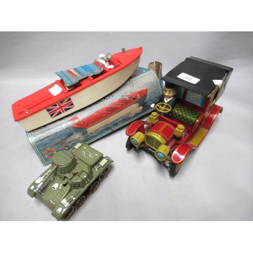 326 - LAPS Japanese tin plate battery operated model car, together with a small German Gama tin plate cloc... 