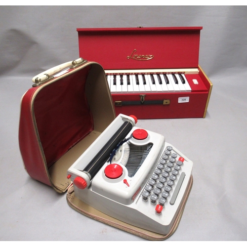 328 - Mid 20th Century child's portable organ by Lorenzo in original packaging, together with a child's po... 