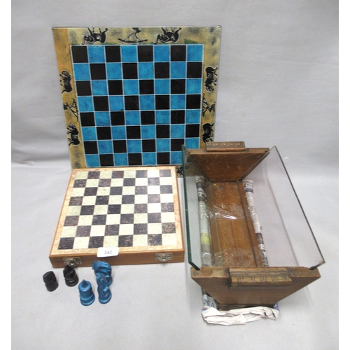 340 - Composite chess set, another chess set and a wooden and glass book rack