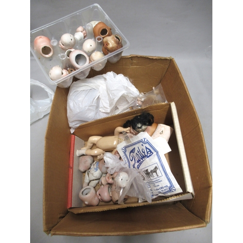 351 - Box of various small bisque and other dolls heads and other small dolls