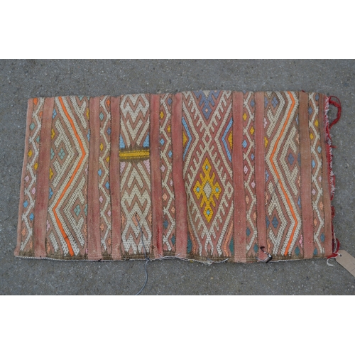 7 - African tribal rug, 180 x 110cm, together with a small Kelim tent bag