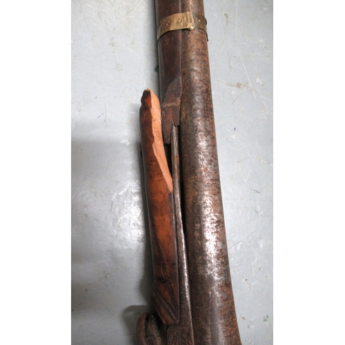 94 - Two reproduction Indian muskets, together with a copper hunting horn and a wooden tripod