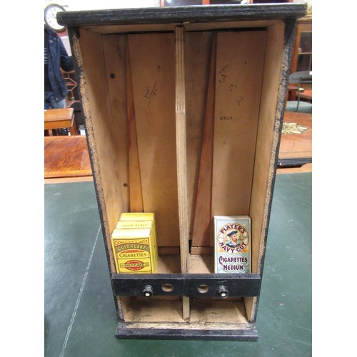 296 - Early 20th Century wooden cigarette dispensing machine, various tobacco tins and a cigar press