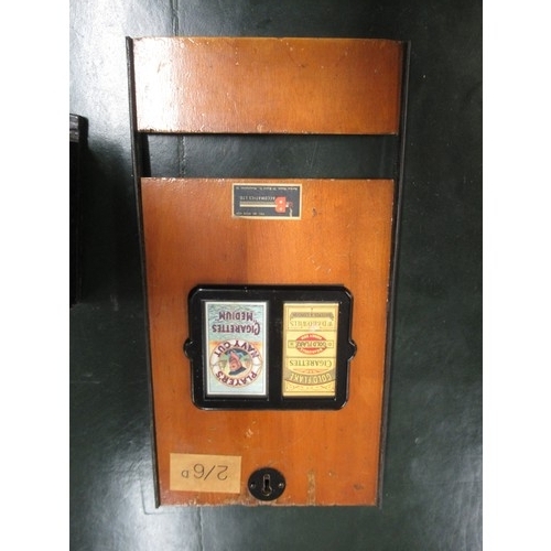 296 - Early 20th Century wooden cigarette dispensing machine, various tobacco tins and a cigar press