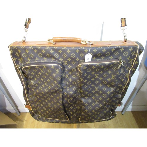 46 - Vintage Louis Vuitton garment carrier bag crafted from the brand's signature monogram canvas with le... 