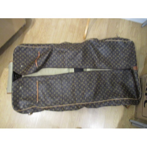 46 - Vintage Louis Vuitton garment carrier bag crafted from the brand's signature monogram canvas with le... 