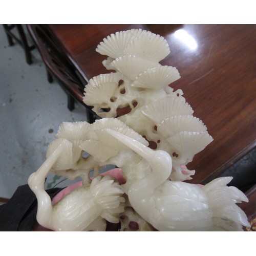 84 - Carved soapstone group of birds, together with a carved soapstone figure of a Chinese deity