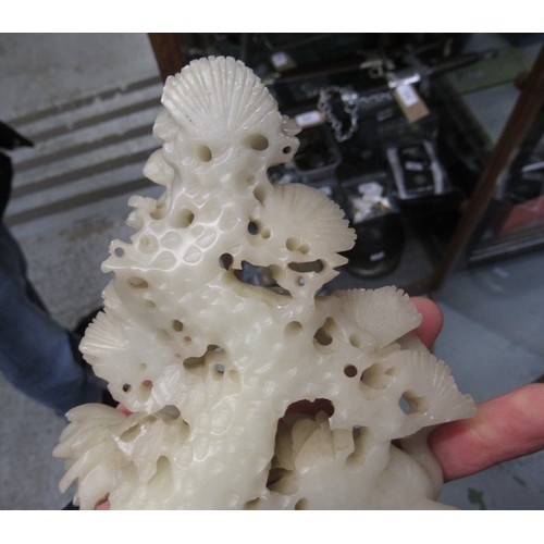 84 - Carved soapstone group of birds, together with a carved soapstone figure of a Chinese deity