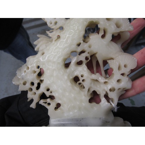 84 - Carved soapstone group of birds, together with a carved soapstone figure of a Chinese deity