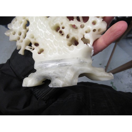 84 - Carved soapstone group of birds, together with a carved soapstone figure of a Chinese deity