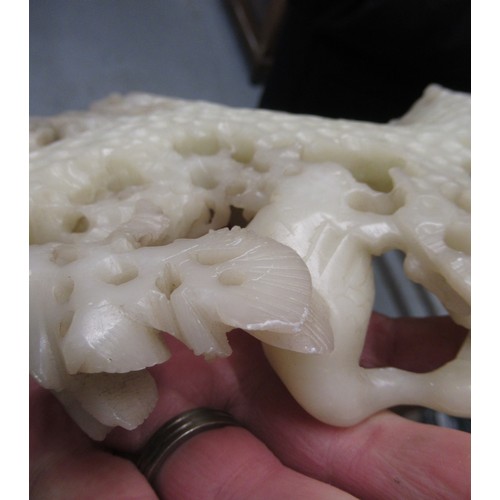 84 - Carved soapstone group of birds, together with a carved soapstone figure of a Chinese deity