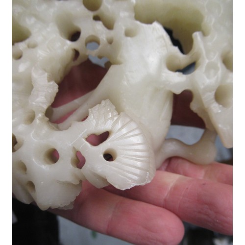 84 - Carved soapstone group of birds, together with a carved soapstone figure of a Chinese deity