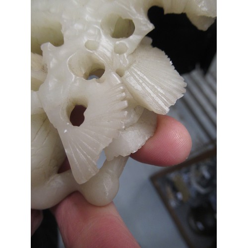 84 - Carved soapstone group of birds, together with a carved soapstone figure of a Chinese deity