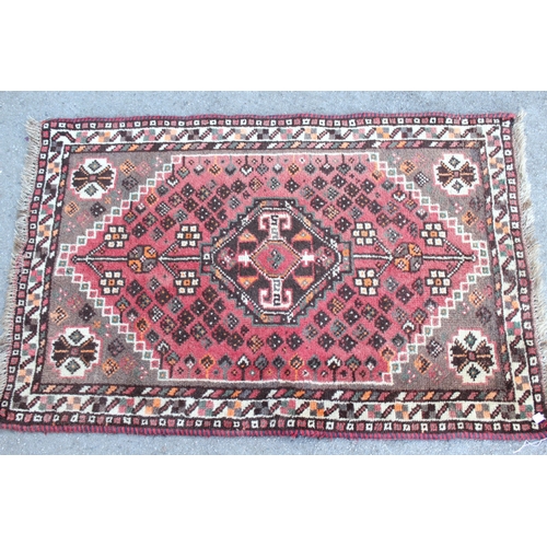 14 - Two small Hamadan rugs with medallion centre decoration, 13 x 82cm