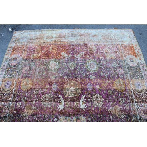 3 - Antique Kayseri rug with all over palmette and animal design on a claret ground with borders, 290 x ... 