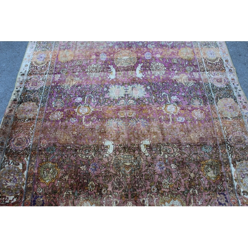3 - Antique Kayseri rug with all over palmette and animal design on a claret ground with borders, 290 x ... 