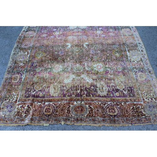 3 - Antique Kayseri rug with all over palmette and animal design on a claret ground with borders, 290 x ... 