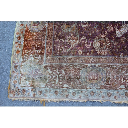 3 - Antique Kayseri rug with all over palmette and animal design on a claret ground with borders, 290 x ... 