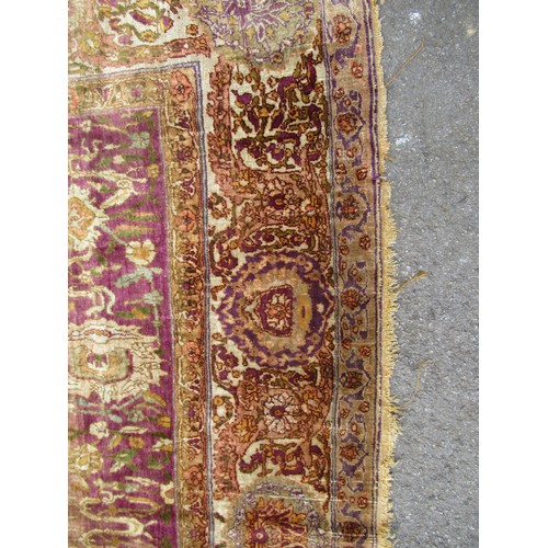 3 - Antique Kayseri rug with all over palmette and animal design on a claret ground with borders, 290 x ... 