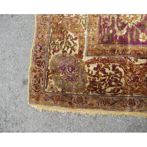 3 - Antique Kayseri rug with all over palmette and animal design on a claret ground with borders, 290 x ... 