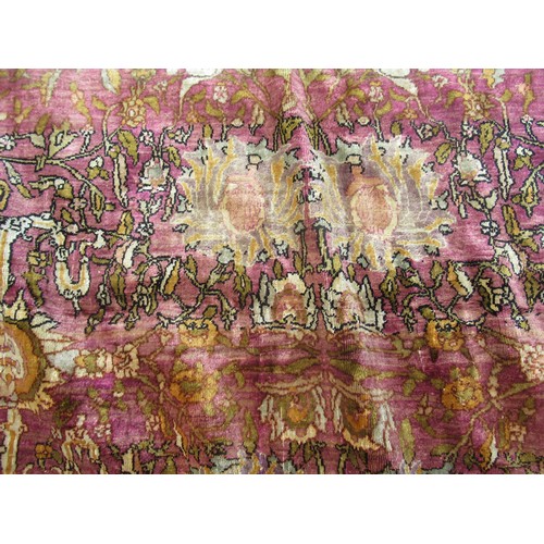 3 - Antique Kayseri rug with all over palmette and animal design on a claret ground with borders, 290 x ... 