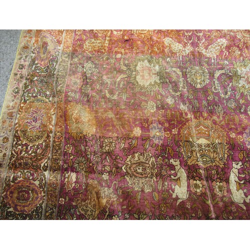 3 - Antique Kayseri rug with all over palmette and animal design on a claret ground with borders, 290 x ... 