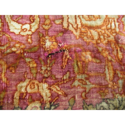 3 - Antique Kayseri rug with all over palmette and animal design on a claret ground with borders, 290 x ... 