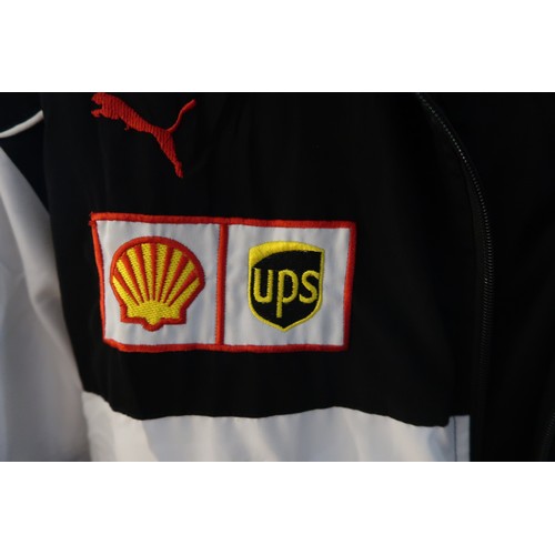 42 - Ferrari Bridgestone jacket, with advertising for Shell and UPS