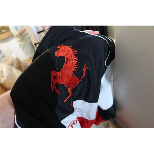42 - Ferrari Bridgestone jacket, with advertising for Shell and UPS