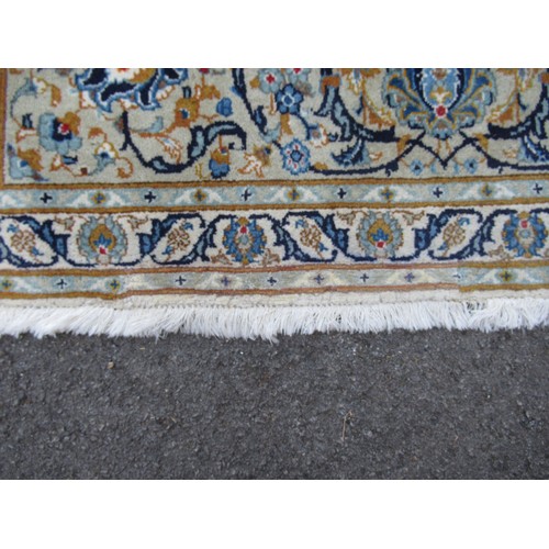 22 - Tabriz carpet of all-over floral design, with multiple borders, on a beige ground, 414cm x 286cm