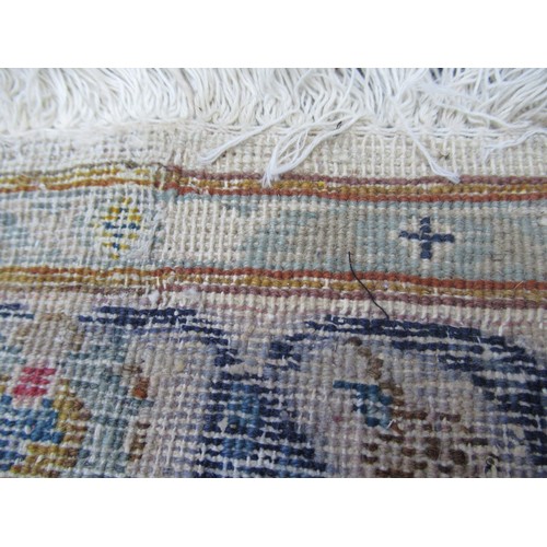 22 - Tabriz carpet of all-over floral design, with multiple borders, on a beige ground, 414cm x 286cm