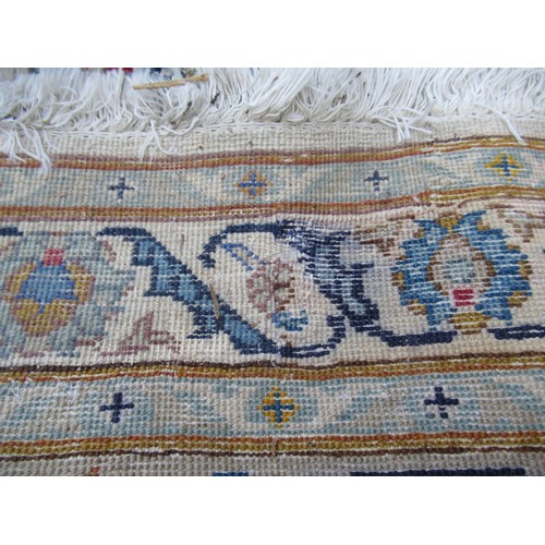 22 - Tabriz carpet of all-over floral design, with multiple borders, on a beige ground, 414cm x 286cm