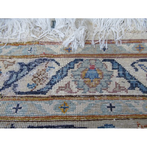 22 - Tabriz carpet of all-over floral design, with multiple borders, on a beige ground, 414cm x 286cm