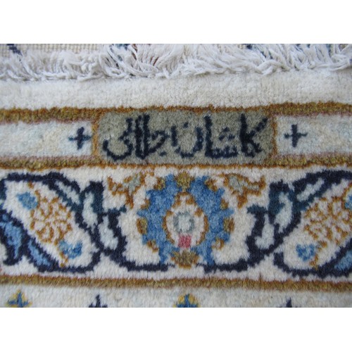 22 - Tabriz carpet of all-over floral design, with multiple borders, on a beige ground, 414cm x 286cm
