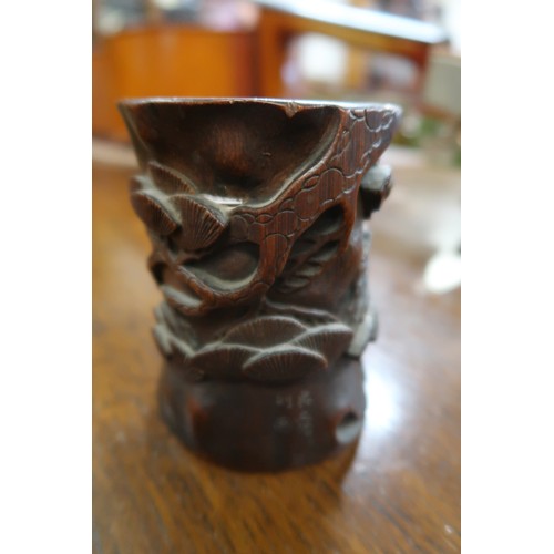 58 - Chinese carved bamboo brush pot decorated in high relief with figures and foliage, carved four chara... 