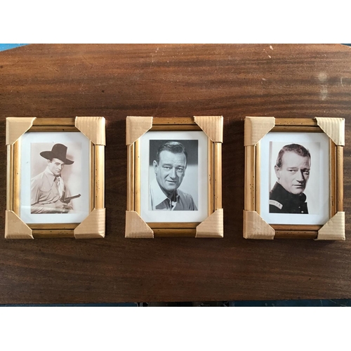 221 - John Wayne trio of photographs. Three newly framed John Wayne Black and White Photographs in matchin... 
