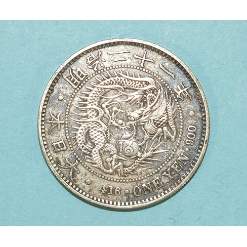 112 - A Japanese silver one Yen coin, weighs 26.8g.