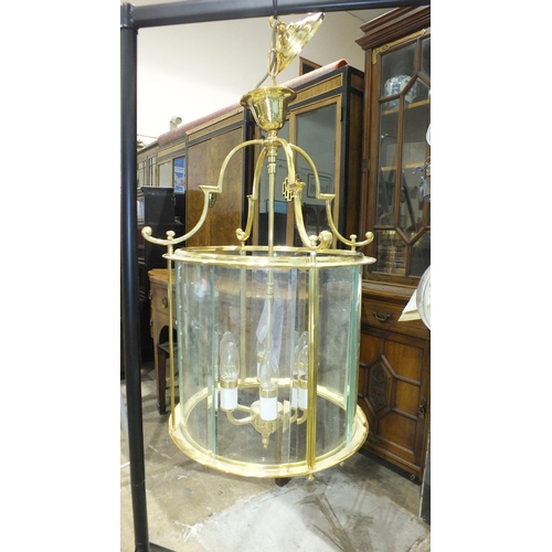 107 - A large modern hanging electric light lantern, of cylinder shape, 63cm high.