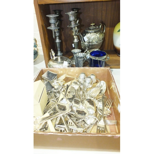 111 - A pair of plated candelabra, an embossed plated teapot, various cutlery and other plated ware.