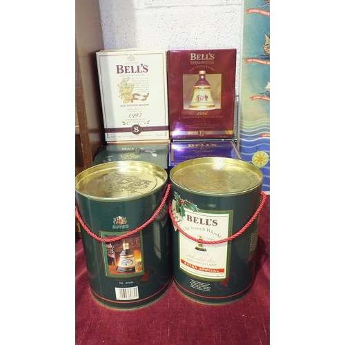 123 - A collection of eight Bell's Old Scotch Whisky decanters: Christmas 1988, 1989, both in drum contain... 