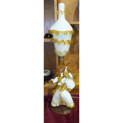 162 - A Murano white and amber glass lamp in the form of two dancing figures, with inverted bell shape sha... 