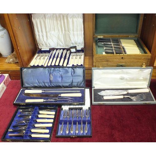 163 - A set of six engraved silver-plated fish eaters in fitted case, and other plated cutlery.