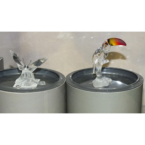 190 - A Swarovski crystal glass figure of a toucan and another of a butterfly on a leaf, both boxed, (2).