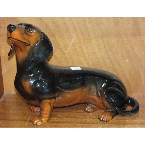 193 - A Beswick black and tan gloss Dachshund, model number 2286, 27cm high.