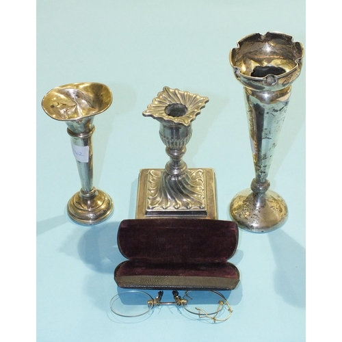 200 - Two damaged silver spill vases, a plated loaded candlestick and a pair of gold-plated pince nez.