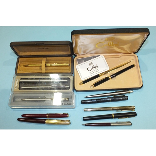 211 - A Mabie, Todd & Co. 'Swan' self-filler fountain pen, with 14ct nib, a Parker Slimfold fountain pen, ... 