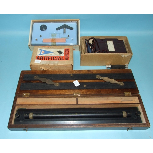 72 - A Ministry of Defence bronze parallel rolling rule, patent 160100 in fitted box, an old ebony and br... 