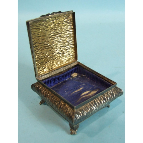 27 - A square embossed jewellery box of compressed form, with overall textured finish, Birmingham 1907 an... 