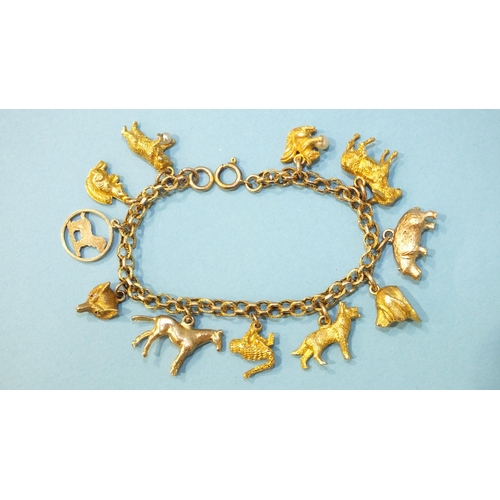 309 - An unmarked gold fancy-link bracelet with eleven 9ct gold charms, all animals, chain length 16cm, 28... 