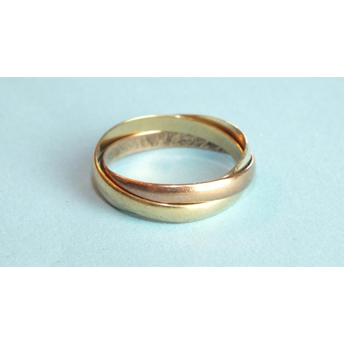 311 - A 9ct tri-colour gold Russian wedding ring of three bands, size T, 3.6g.